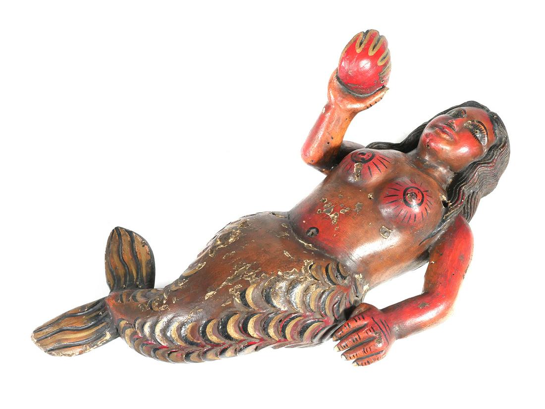 Mexican Folk Art Carved Wooden Mermaid: Carved folk art wooden mermaid holding a shell, likely Mexican. Hand painted. Measures 24" at it's longest. Circa early to mid-20th century. Very good condition with some wear to finish and holes at s