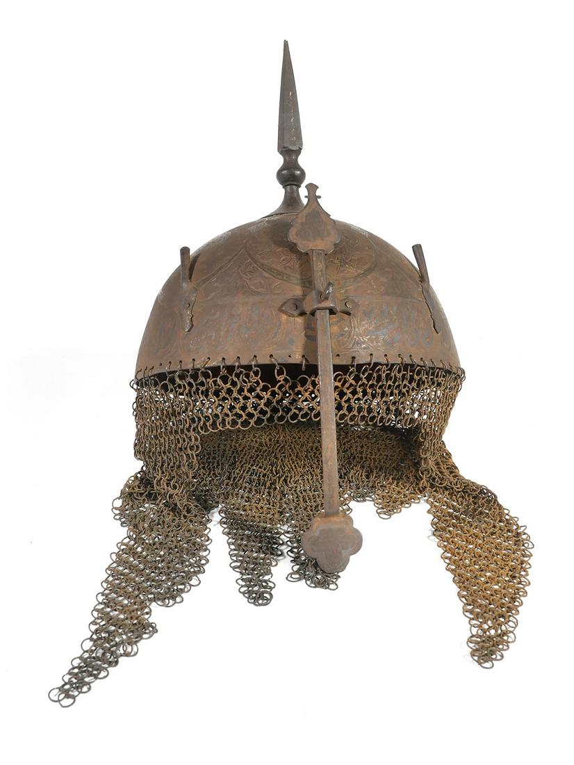 Indo Persian Mughal Spiked Top Helmet: Known as a "top," this helmet likely dates from the 19th century, possibly earlier. Ornate (but difficult to photograph the designs), with set screw adjusted nose guard. Set screw holds, but threads a