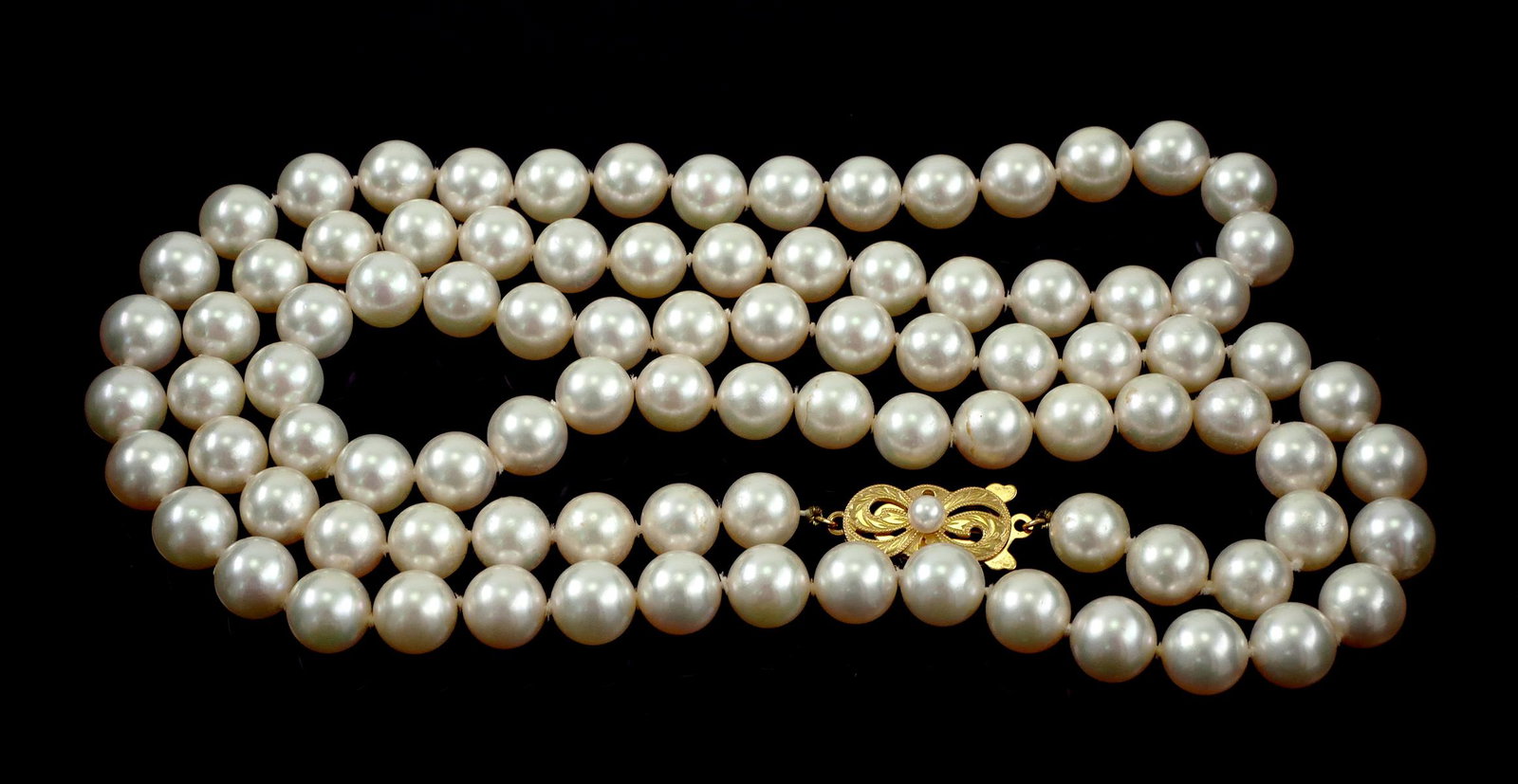 MIKIMOTO Pearl Necklace, 18K Clasp: Vintage Mikimoto pearl necklace with gold clasp showing Mikimoto mark and "750" for 18k gold. Pearls measure 8mm. Necklace is 31" long. Excellent condition.