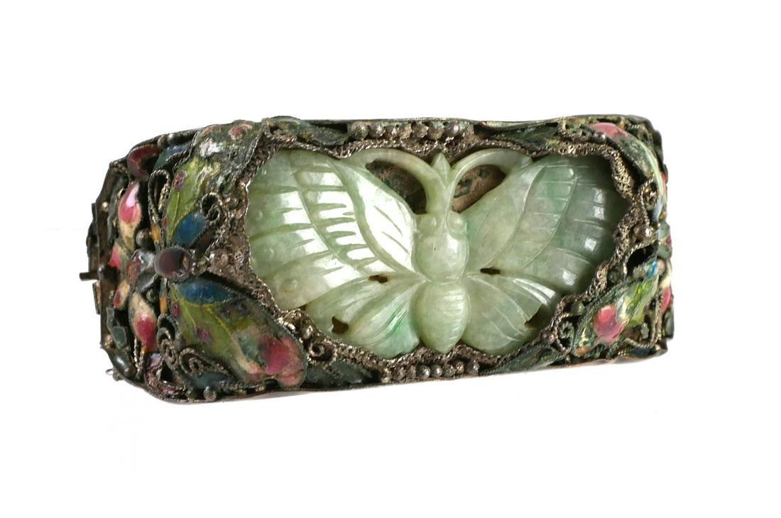 Antique Chinese Jade & Enamel Bracelet: Qing era, possibly as late as early 20th century, enameled bracelet with mounted carved jade butterfly. Bracelet appears to be silver washed brass or copper. Nice filigree work. Not champleve or clois