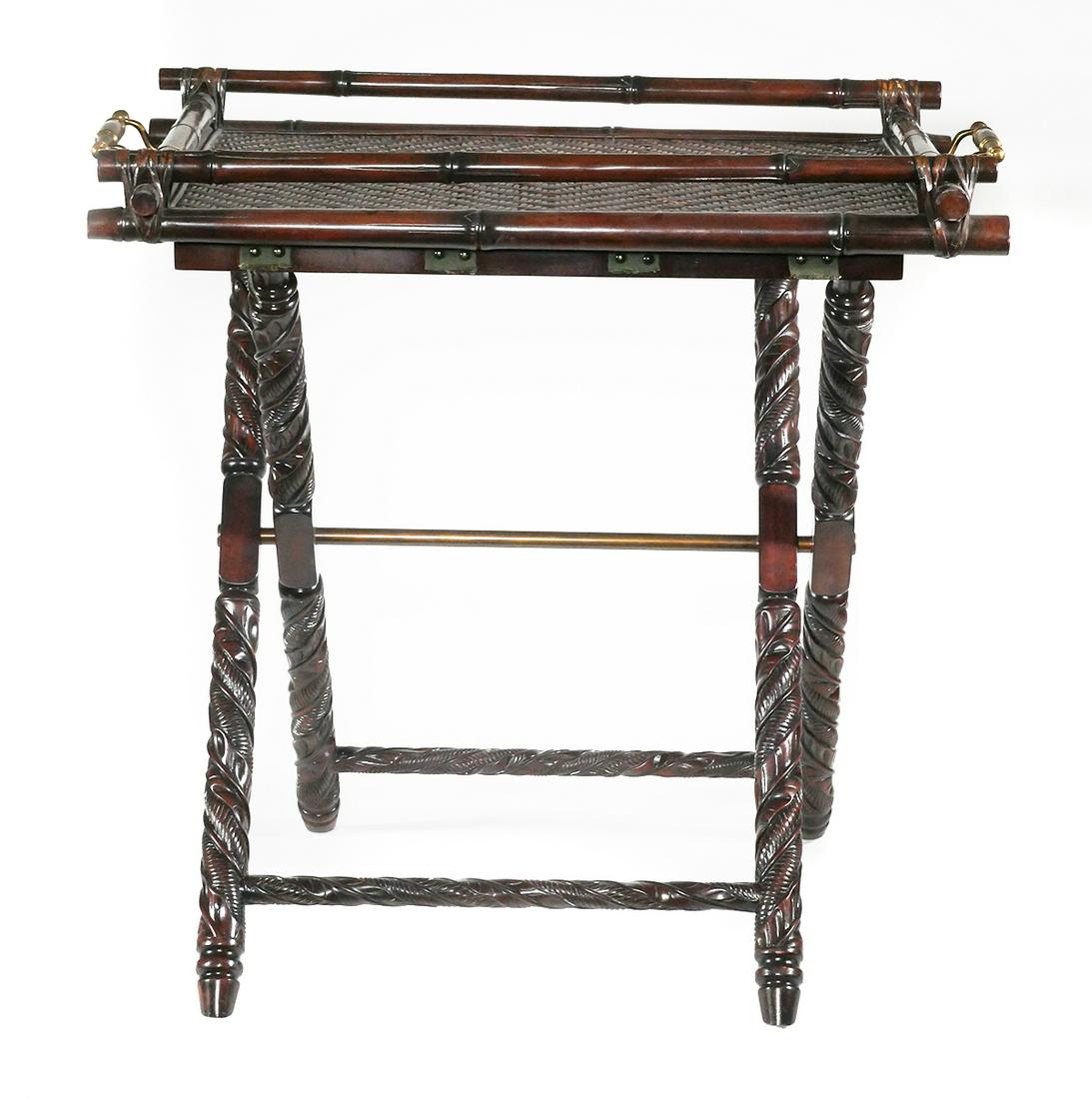 RALPH LAUREN Sussex Butler's Tray: Butler's table by Ralph Lauren Home. Carved, solid mahogany folding base with brass accents; removable tray with woven rattan inlay and brass handles. Floor model with commensurate wear including wear