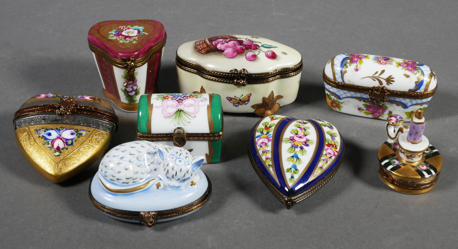 (8) LIMOGES France Porcelain Trinket Box: Collection of 8 Peint Main (hand painted) Limoges France porcelain trinket boxes. Gold trim with floral designs. All are marked Limoges France. Sleeping cat, green chest, gold heart w/ perfume & box w