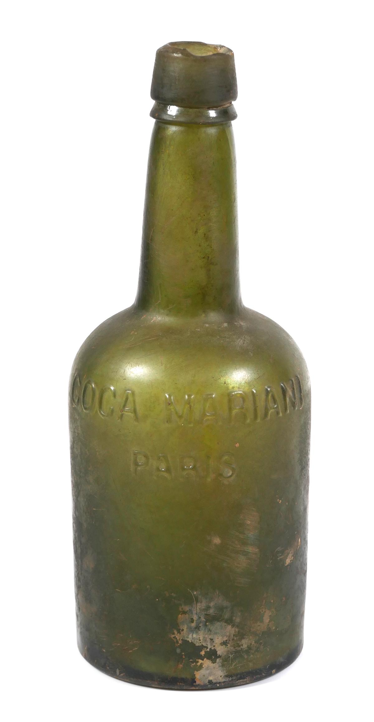 Coca Mariani (Cocaine Wine) Paris, 1880s Bottle: Bottle measures 9" high and is guaranteed to be authentic. A few old flakes around mouth of bottle, else undamaged. Strong lettering. According to an online source: Vin Mariani was a tonic and patent 