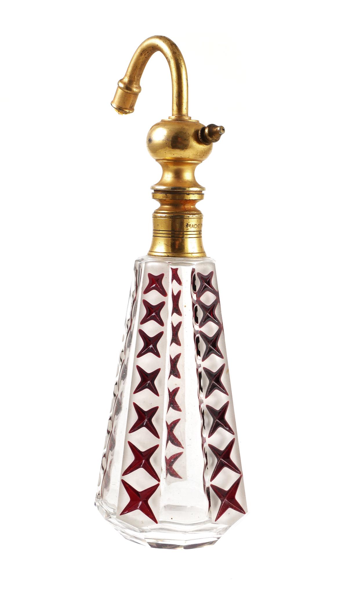 Antique French Deco Art Glass Perfume Bottle: Vintage French Art Deco period perfume bottle. Frosted panels, each with red stars, alternating with clear panels. Brass atomizer hardware marked "Made in France." Measures aout 7-1/2" high.