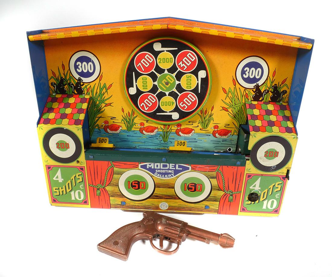 Wyandotte Tin Litho Mechanical Shooting Gallery: Wyandotte Tin Litho Mechanical Shooting Gallery. One plastic pistol is included, no darts. Missing key. Windup mechanism works but needs new belts. Box has wear, stains, tape marks & tears. Blackwell 