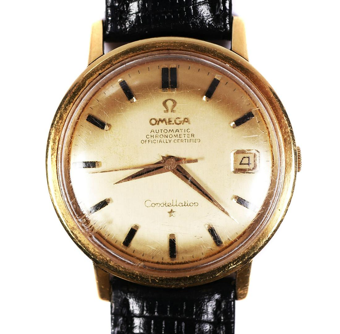 Vintage OMEGA Constellation 18k Gold Men's Watch: Vintage Omega Constellation automatic chronometer in 18k gold case. New black leather bracelet. Case measures about 35mm diameter. Fine working condition. From estate, so professional maintenance reco
