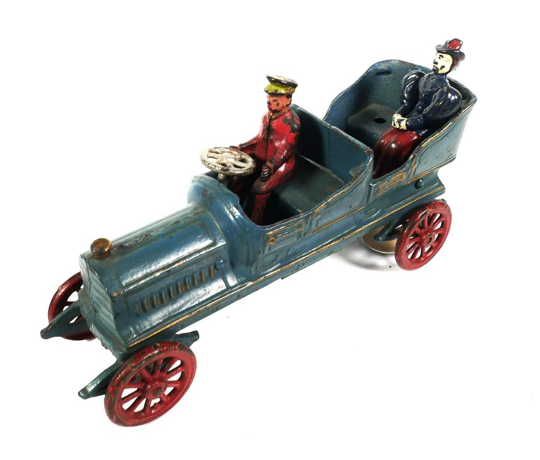 Jones & Bixler Kenton Cast Iron Open Touring Car: Jones & Bixler or Kenton cast iron open touring car with driver & woman passanger. Car measures approx. 10" x 4 1/4" x 3". Car, driver & passanger all have wear & paint loss. Blackwell Auctions guaran