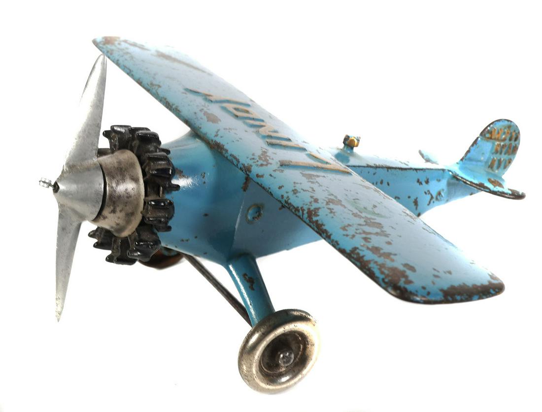 HUBLEY Cast Iron Blue LINDY Toy Airplane: Hubley cast iron blue "LINDY" plane. 10" wingspan x 9 1/2" long. Tail is marked NX211 RYAN NYP. The Spirit of St. Louis (formally the Ryan NYP, registration: N-X-211) is the custom-built, single engin