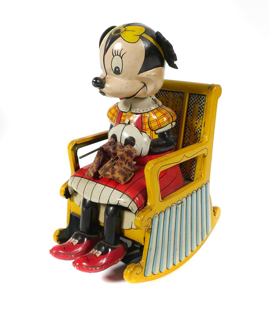 LINEMAR Tin Litho Disney Minnie Mouse Knitter: Walt Disney Productions Linemar Japan tin lithograph wind Up Minnie Mouse knitting in rocking chair. Line Mar was founded in the 1950s as a manufacturing and import subsidiary of the successful Americ
