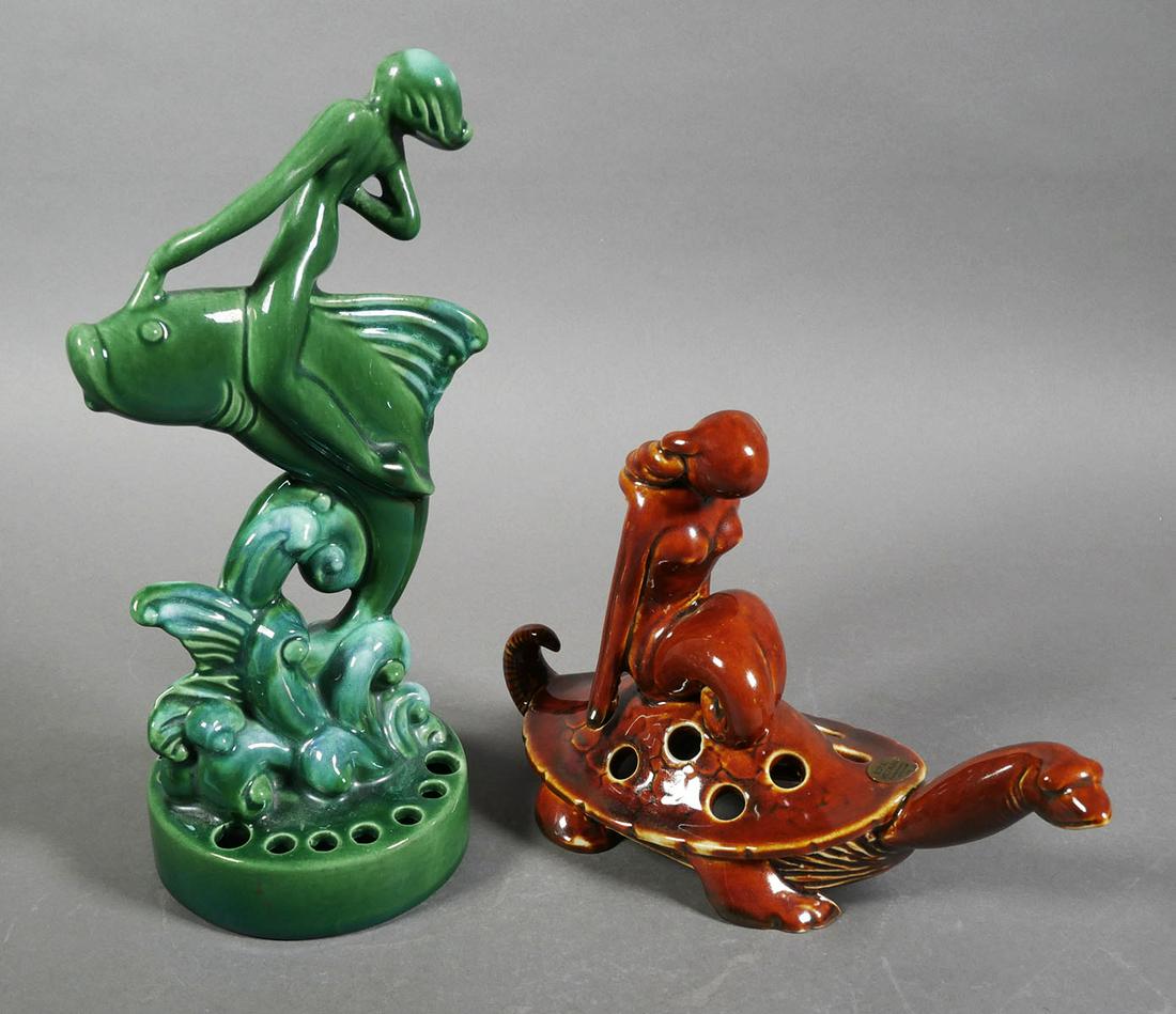 ROYAL HICKMAN 2 Nude Flower Frogs: Royal Hickman flower frogs, measuring 6" and 10" high, depicting nude women riding a tortoise and another riding a leaping fish. No damage. Paper label intact on the turtle figure. Hickman worked with