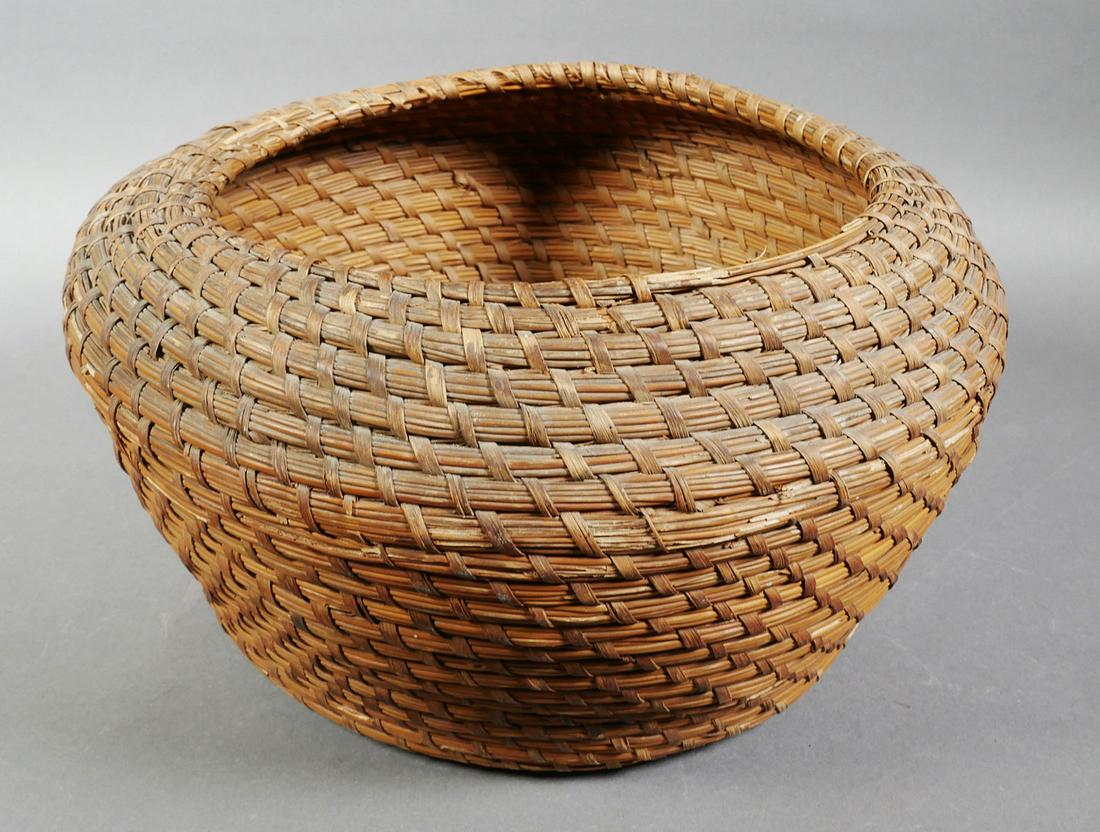 SEMINOLE INDIAN Woven Pine Needle Basket: Vintage basket, woven from pine tree needles by Seminole Indians in southern Florida. Height 8", width at waist 13", opening 9".. Still quite supple. Rim has small area where thread tying together nee