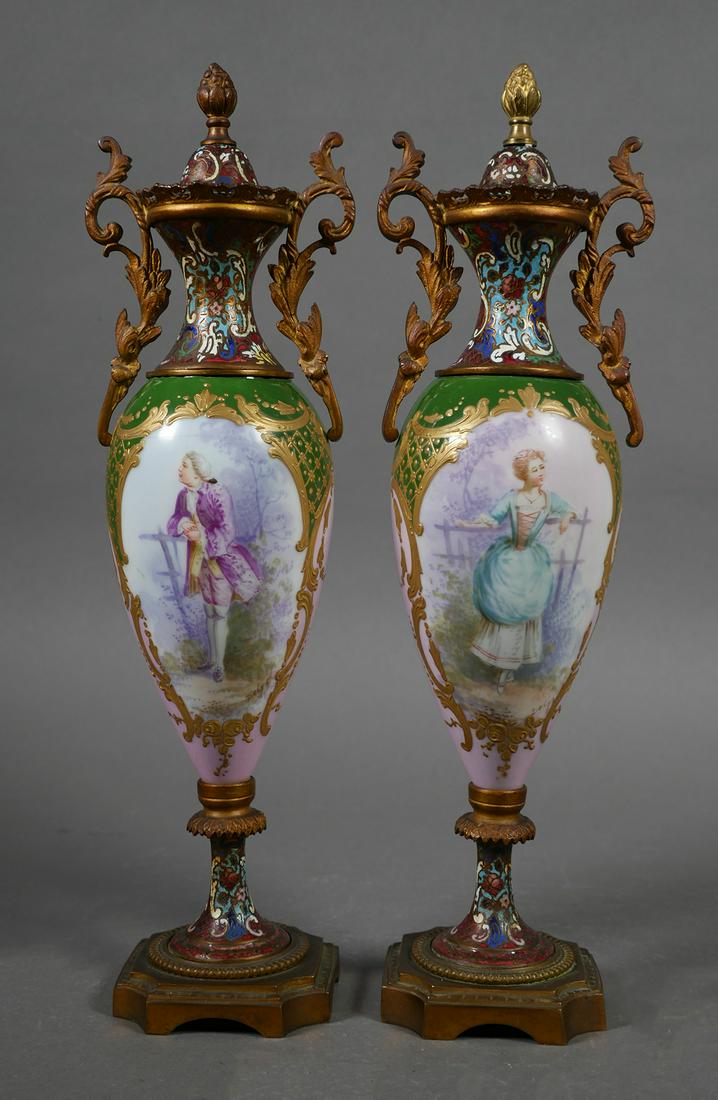 Antique Sevres Porcelain Urns (2): Two antique matching Sevres or Sevres-style porcelain lidded urns, with enamel and ormolu decorations. One urn features a painting of a woman, the other a man. Nice art work. 12" tall, unmarked.