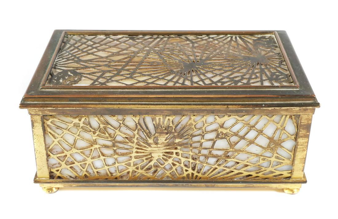 TIFFANY STUDIOS Pine Needle Bronze Box: Antique circa 1910 Tiffany Studios #816 dore bronze and slag glass box, measuring about 6-1/2" wide and 2-7/8" high. Chips on one end panel and the bottom panel -- chip pieces included. Gilt wear, pri