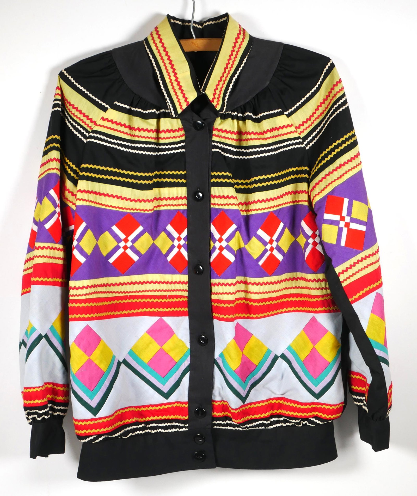 Vintage Seminole Indian Patchwork Jacket: This vintage jacket is made in the traditional style by Florida Seminole Indians.The work is very professional and the machine-sewn pattern is excellent. Colors are bright and vibrant. Size appears to