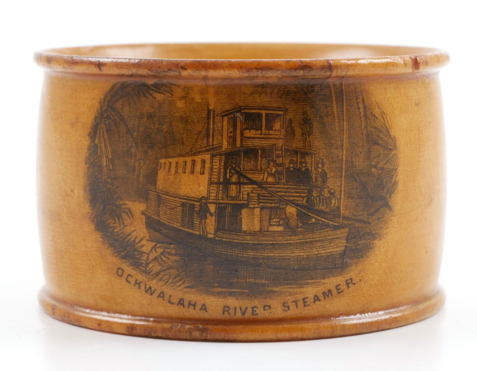 19C Mauchline Ware Ocklawaha Napkin Ring: Late 19th century Mauchlineware napkin ring depicting the "Ockwalaha River Steamer." Measures 1-1/4" wide.