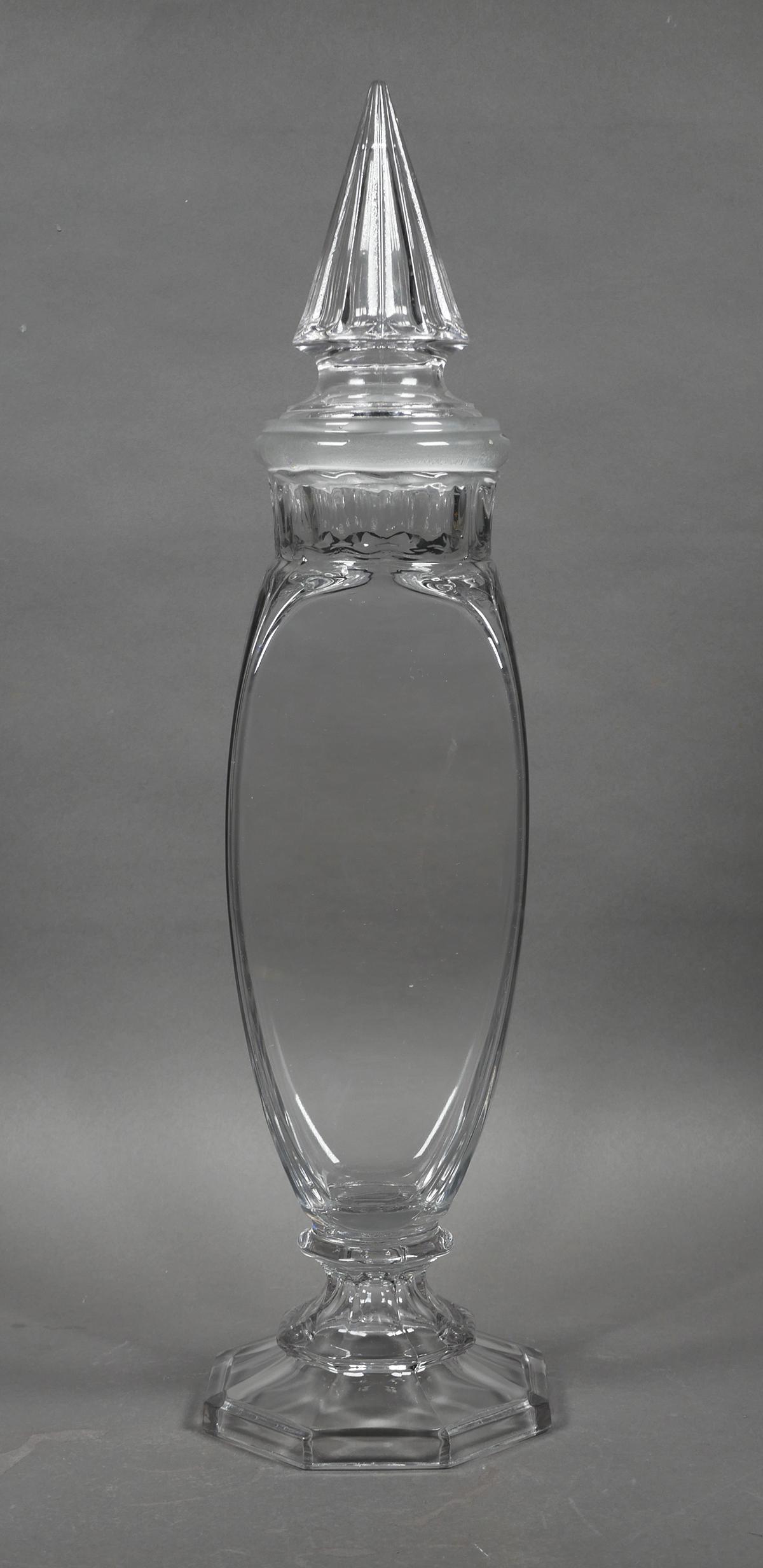Vintage Glass Drug Store Candy Apothecary Jar: Large vintage apothecary or candy jar measuring 21" x 5 1/2" x 5 1/2" at the base. Stopper has some chips on the rim. Jar has small chip on rim and base edge. Light wear marks and scratches to glass.