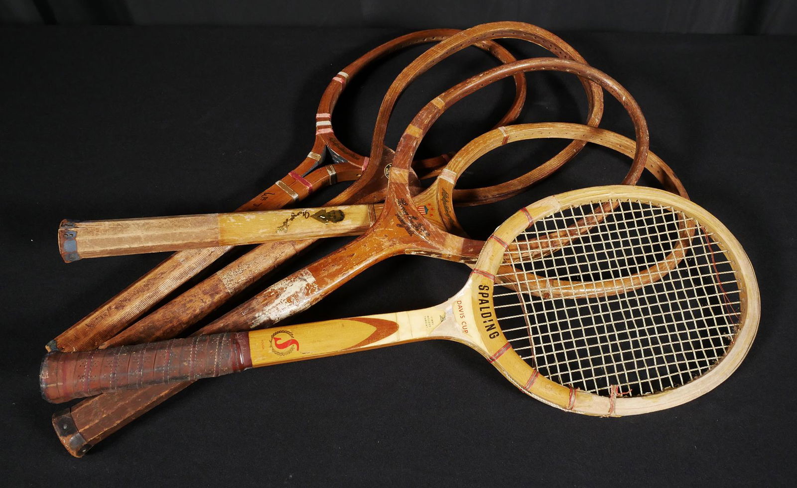 (5) Antique Tennis Racquets, Portraits: Five antique wooden tennis rackets, including a GEORGE LOTT portrait Contender, "The Bat" VINCENT RICHARDS signature model by Harry C. Lee, a BILL TILDEN portrait Spalding, a Davis Cup and an older Sp