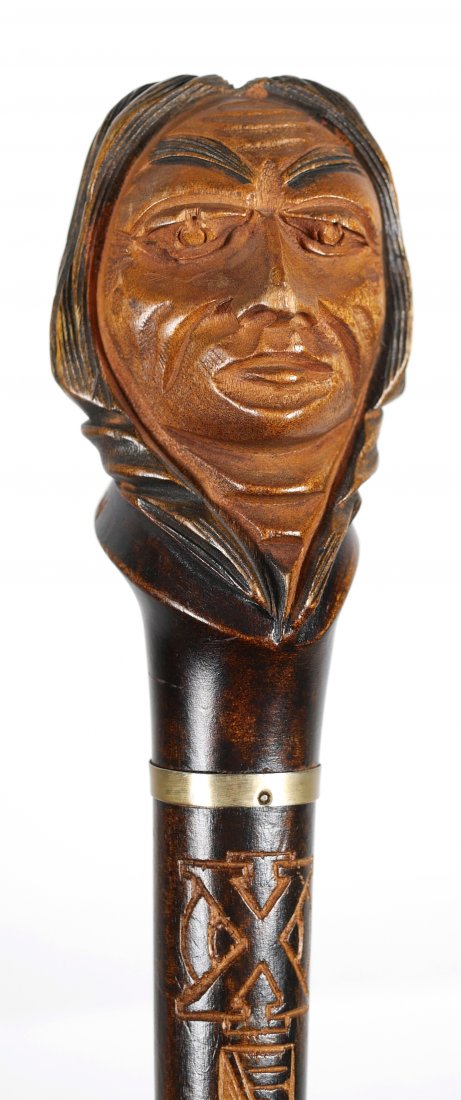 Dartmouth CHI PHI Fraternity Cane Indian Head: Circa 1940s fraternity carved walking stick, bearing the conjoined Chi Phi logo near the top, just under the bust of the Indian, representing the University of Massachusetts - Dartmouth. Several dozen