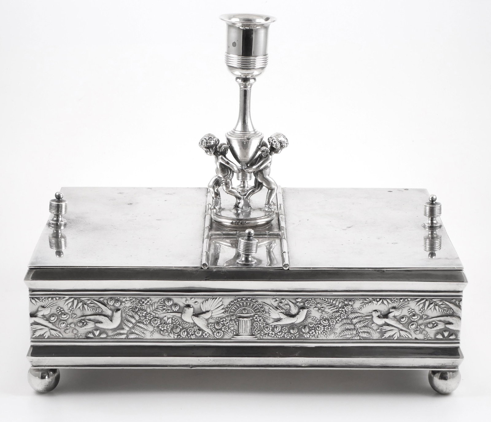 Victorian Silver Figural Cigar Humidor: Circa 1865 humidor by Rogers Smith, silverplated, with four hinged doors. Center of top has what appears to be a candlestick holder, but could have held a glass or metal insert for ash. Cherubs holdin