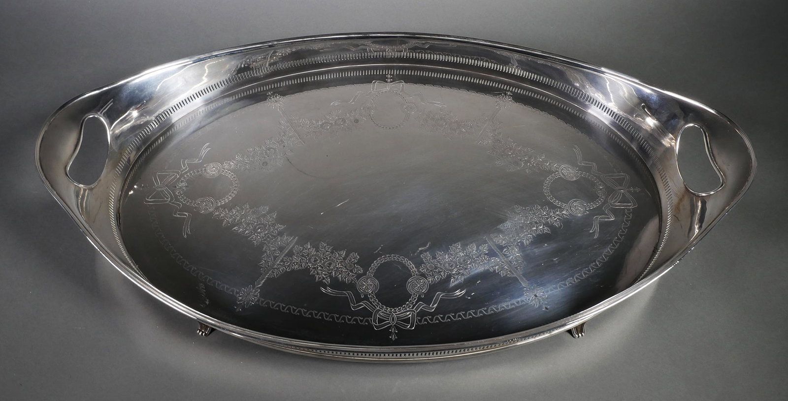 Sheffield Sterling Silver Tea Tray, 96 ozt: English sterling silver footed tea and coffee service tray, bearing 1910 date mark and the hallmark of Sheffield silversmith Hawksworth Eyre. Weighs 96 Troy ounces and measures 26-3/8" handle-to-handl