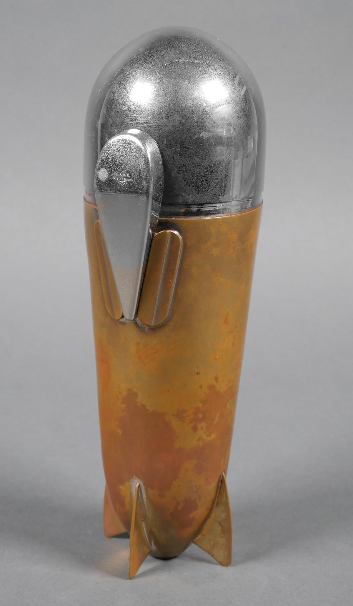 Germany Zeppelin Cocktail Mixer Martini Shaker: Vintage Art Deco German D.R.G.M. (Deutsches Reichs Gebrauchs Muster) Zeppelin Airship Cocktail Shaker. Corkscrew threads into funnel, which sits inside the four cups, which sit under the lidded condim