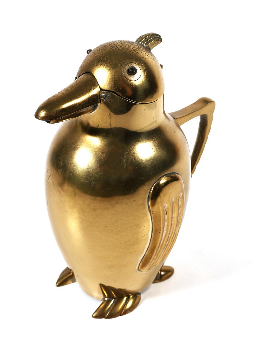 Art Deco Penguin Cocktail Shaker Martini Pitcher: Art Deco cast and molded brass penguin form cocktail shaker martini pitcher. Beak is hinged and opens when tipped by means of internal counter weight. Pitcher measures 7" tall x 5" wide including hand