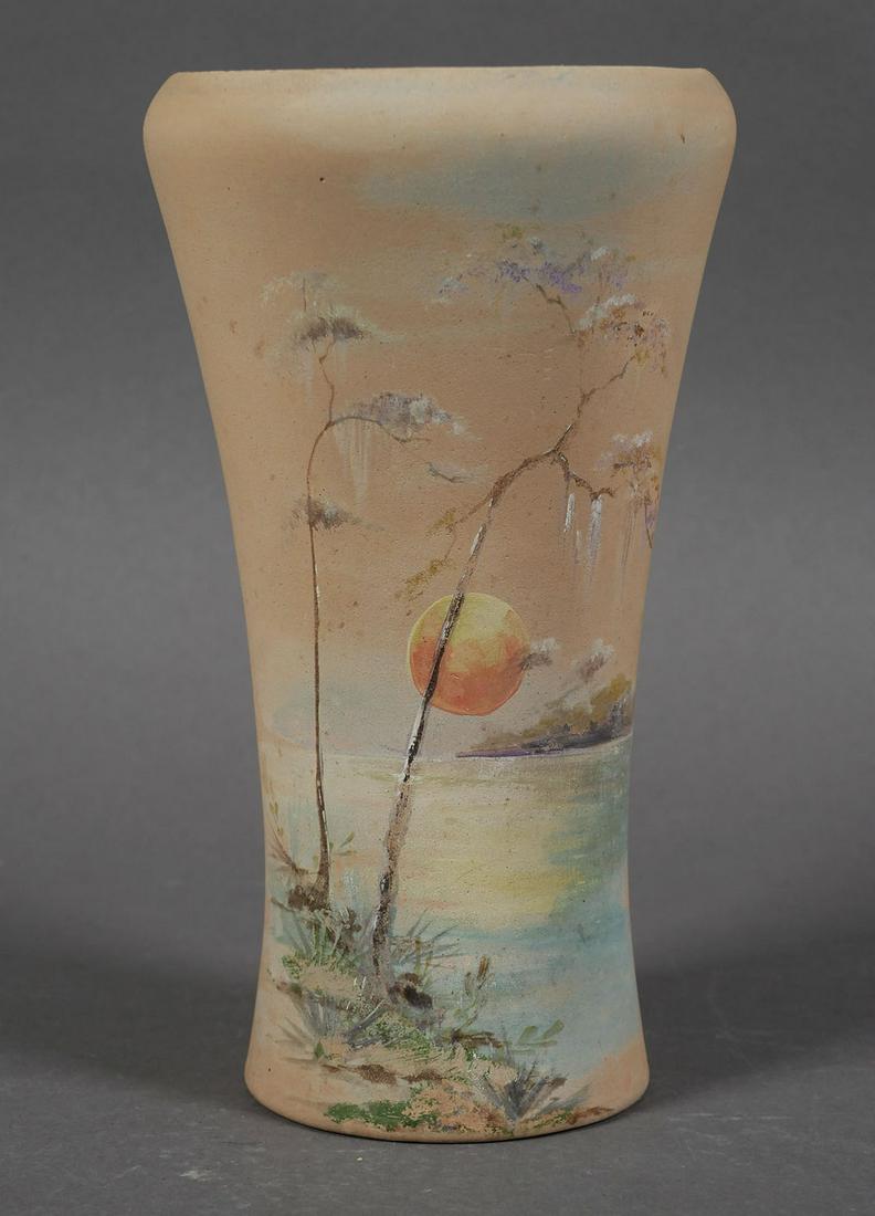 GRAACK POTTERY, Lake Sunset Vase, Florida: Tapered vase with sunset over lake scene. Marked under base for Graack & Son, Bradentown (Bradenton). Early 20th century. Measures 7 1/2" tall. Minor surface/edge wear. No significant chips, cracks or
