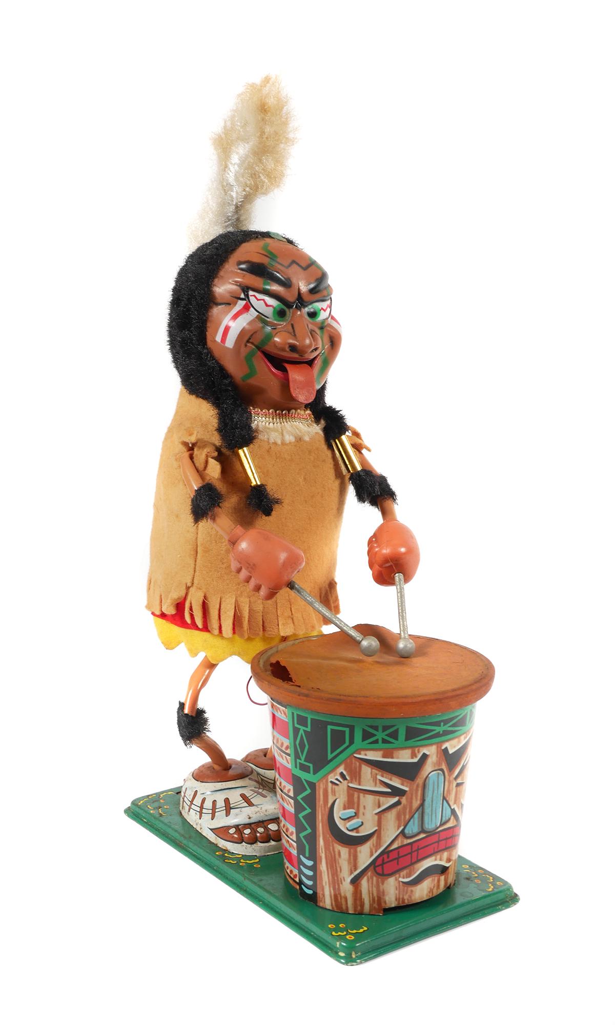 Nutty Mad Indian, Marx Battery Op Toy: Marx made the Nutty Mad Indian in 1964; someone had written that date on the bottom as well. The Indian is 11-1/2" tall and does indeed look crazy. He is supposed to move back and forth, beat his drum