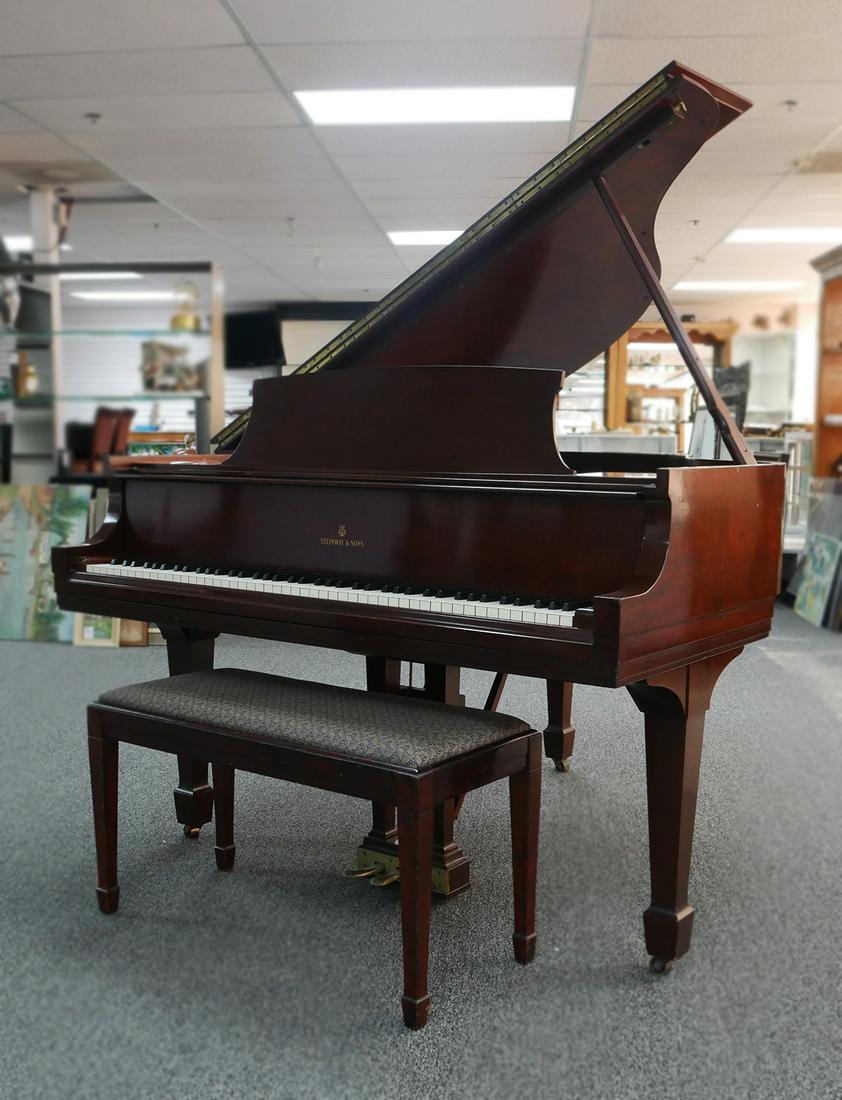 STEINWAY MODEL S Baby Grand Piano: 1954 Steinway baby grand piano, Model S, mahogany. The smallest of the Steinway grands. Measures 5' 1". Ivory keys. Good color, with no fading or discoloration. Top of lid has a number of scratches, a