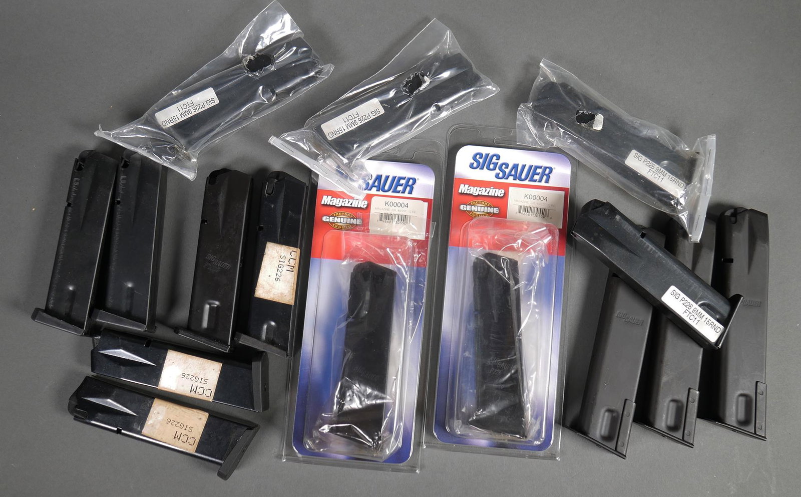 (15) SIG 226 Magazines 9mm 357 40 S&W: Two new .357/40S&W 12 round magazines, ten 15 round 9mm mags, three 20 round 9mm magazines.