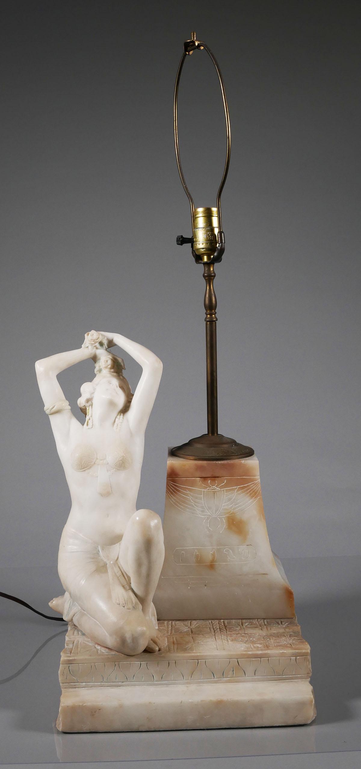 Art Deco Egyptian Alabaster Figural Lamp: Early 20th century table lamp with figure of a smiling (clearly non-Egyptian) woman clad in scant, vaguely Egyptian clothing, next to a pillar with hieroglyphics and a scarab incised on it. Figure is 