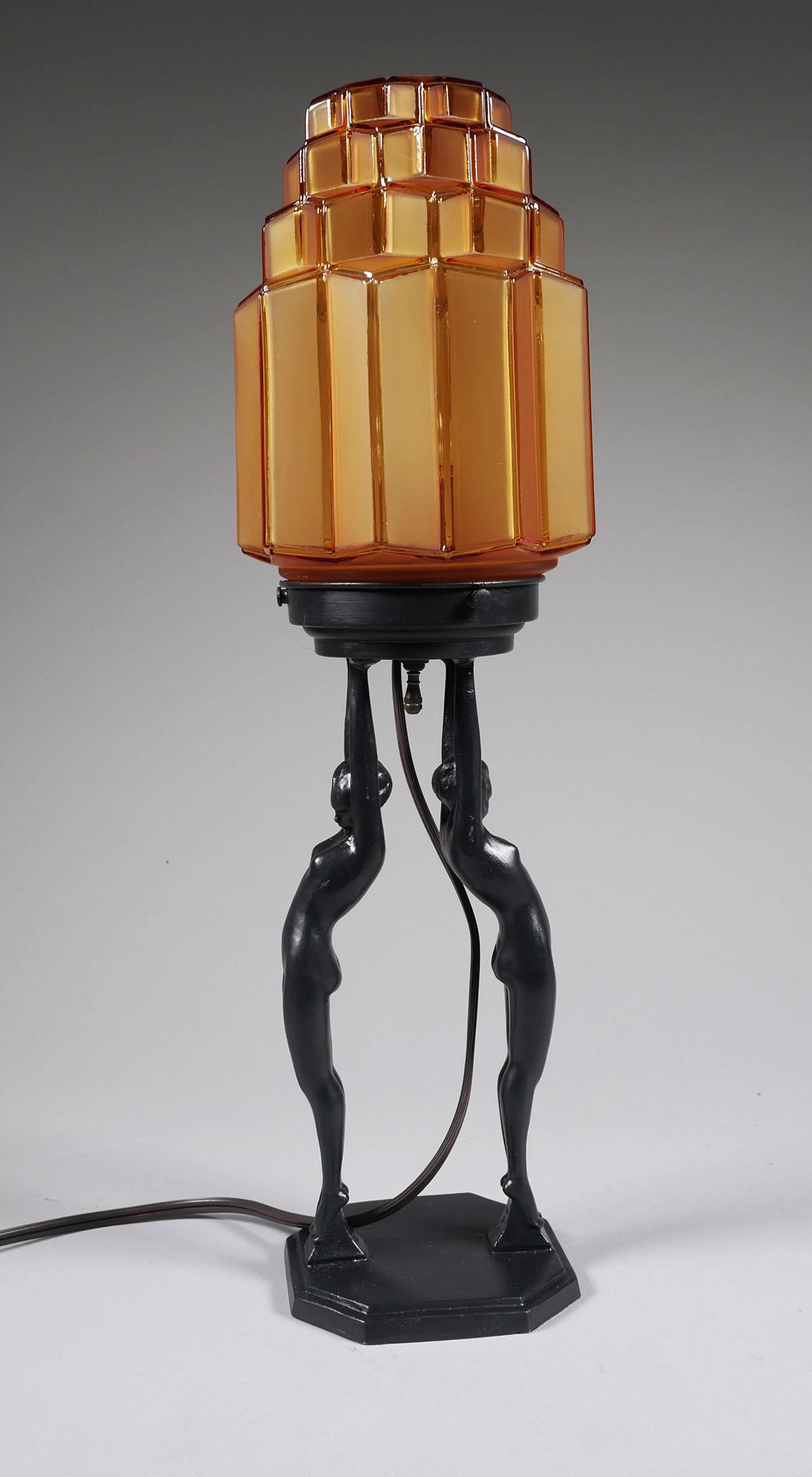 FRANKART Figural Nude Table Lamp: Art deco figural nude table lamp with amber skyscraper glass shade. Marked "FRANKART 27" on the base. Excellent condition with no chips, cracks or damage to the glass and minimal surface wear to the b