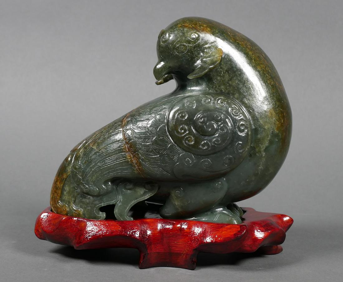 Vintage JADE Mythological Bird Carving Sculpture: Variegated green jade carving of mythological bird. Statue measures 5" tall x 6" long x 3" deep. Wood base included. No chips or repairs. Natural cracks in stone. See photos for more details on condit