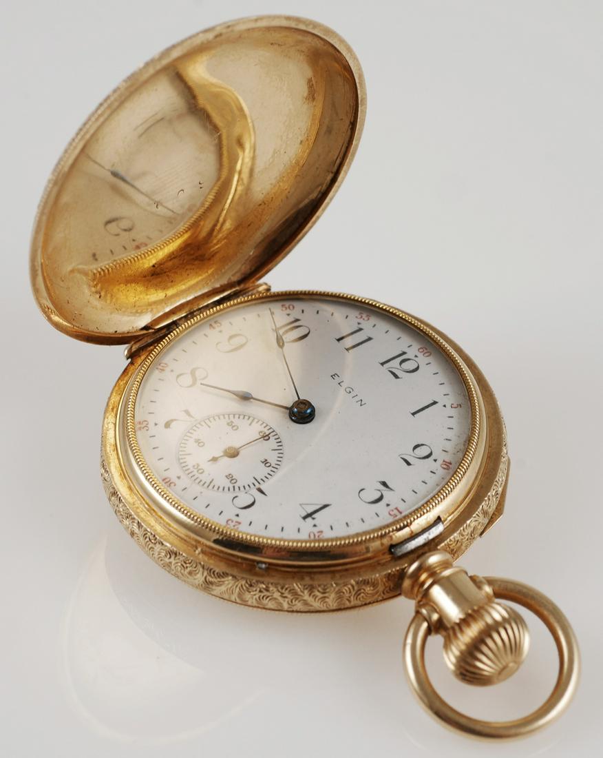 ELGIN 14K Gold Pocket Watch: Elgin 14K multi color yellow gold hunter case pocket watch. Grade 269, model 2, circa 1904. Pocketwatch is size 0s with 7j. Serial number 10636564. Ornate 14K multi color gold case with bird on case b