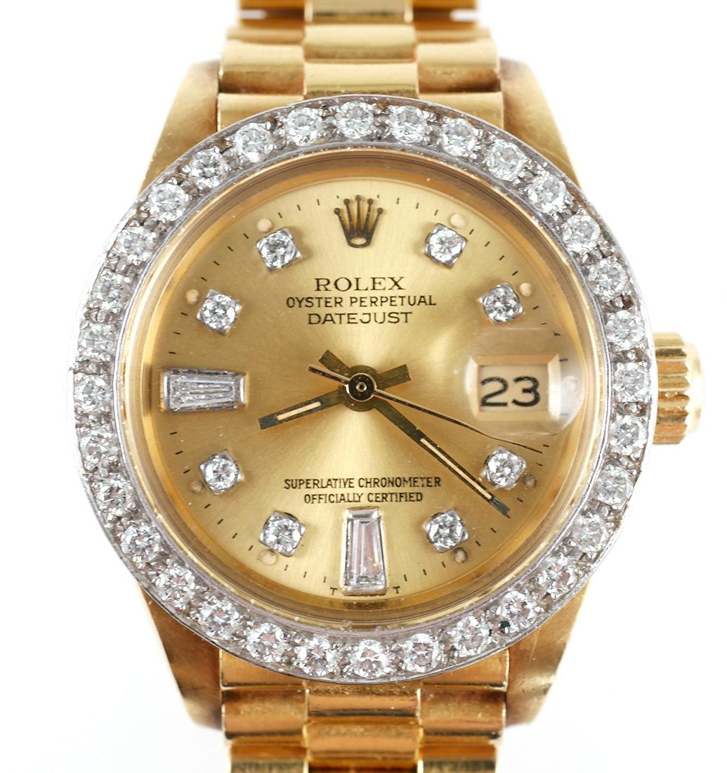 Womens ROLEX 18K Gold Presidential Chronometer: Ladies Rolex in 18K yellow gold and diamond chronometer wrist watch. Watch features Datejust, Oyster Perpetual movement and diamonds on dial and bezel. 26mm case and Presidential bracelet both stamped