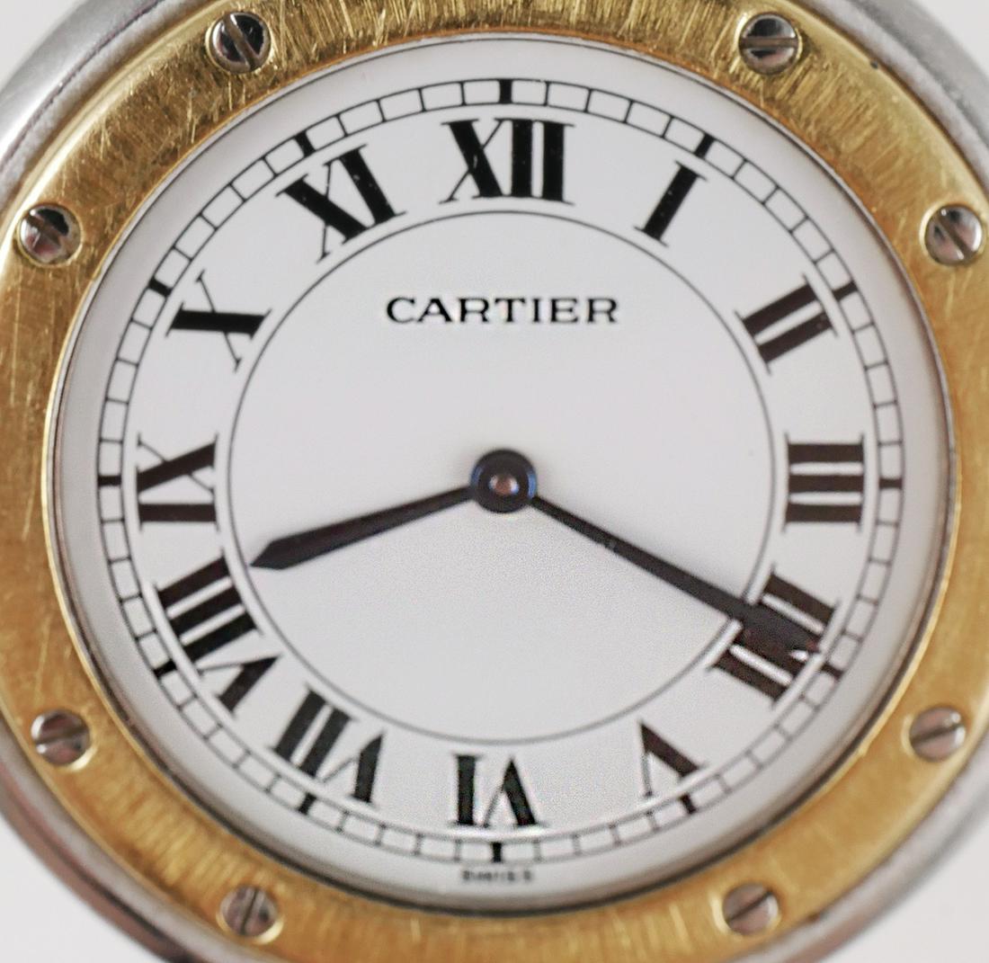 CARTIER Santos Vendome SS 18K Gold Wrist Watch: Vintage Cartier Santos Vendome ladies stainless steel case wristwatch with 18K yellow gold round bezel. White Roman numeral dial with blue hands, sapphire topped crown, and Cartier 81 quartz 9 jewel m