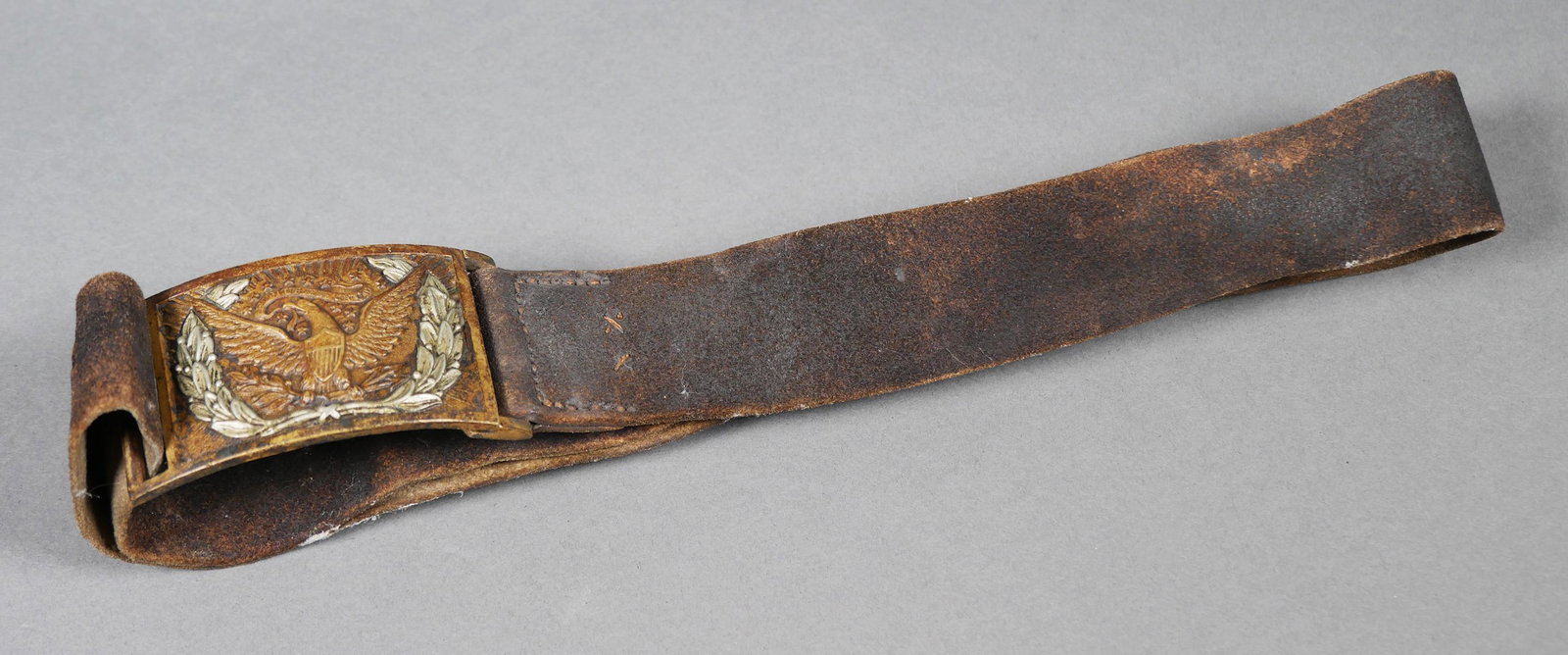 Civil War Era Union Belt Buckle: Civil War era NCO or officer model 1851 eagle with wreath brass and silver overlay buckle, receiver and leather belt. Number 162 on buckle & receiver. Buckle measures 3 1/4" x 2". Normal wear & patina