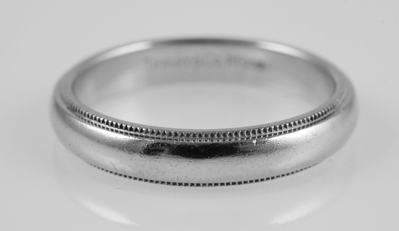 TIFFANY & CO. Platinum Wedding Band Ring PT950: Platinum Tiffany & Co. wedding band size 8.5, 4mm. Signed Tiffany & Co. PT950. Weight 8.5 grams. Good condition with normal wear. See photos for more details on condition.