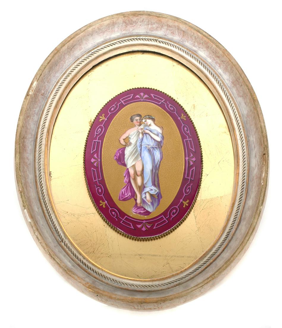 LIMOGES Hand Painted Porcelain Plaque: Continental painting on porcelain plaque depicting two Greek or European women, unsigned. Plaque measures approx. 10" x 7" centered in oval frame 19 1/4" x 15 1/4". Frame has a gold mirror backing wit