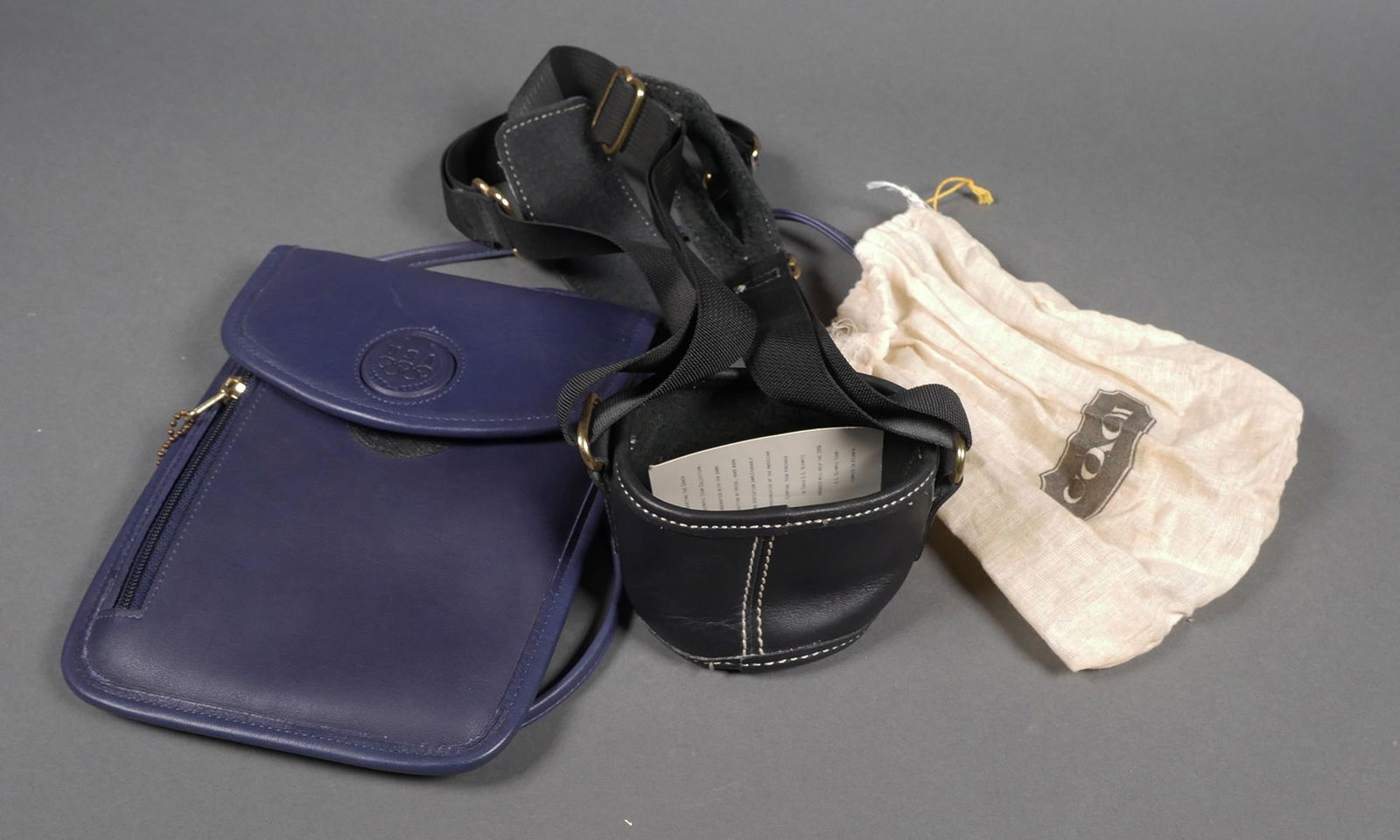 Vintage COACH Olympic Purse & Water Bottle Holder: Two vintage Coach 1996 Atlanta Olympic special edition items. Navy blue leather crossbody bag purse and black leather water bottle holder or carrier. Purse has Olympic logo accent with single leather