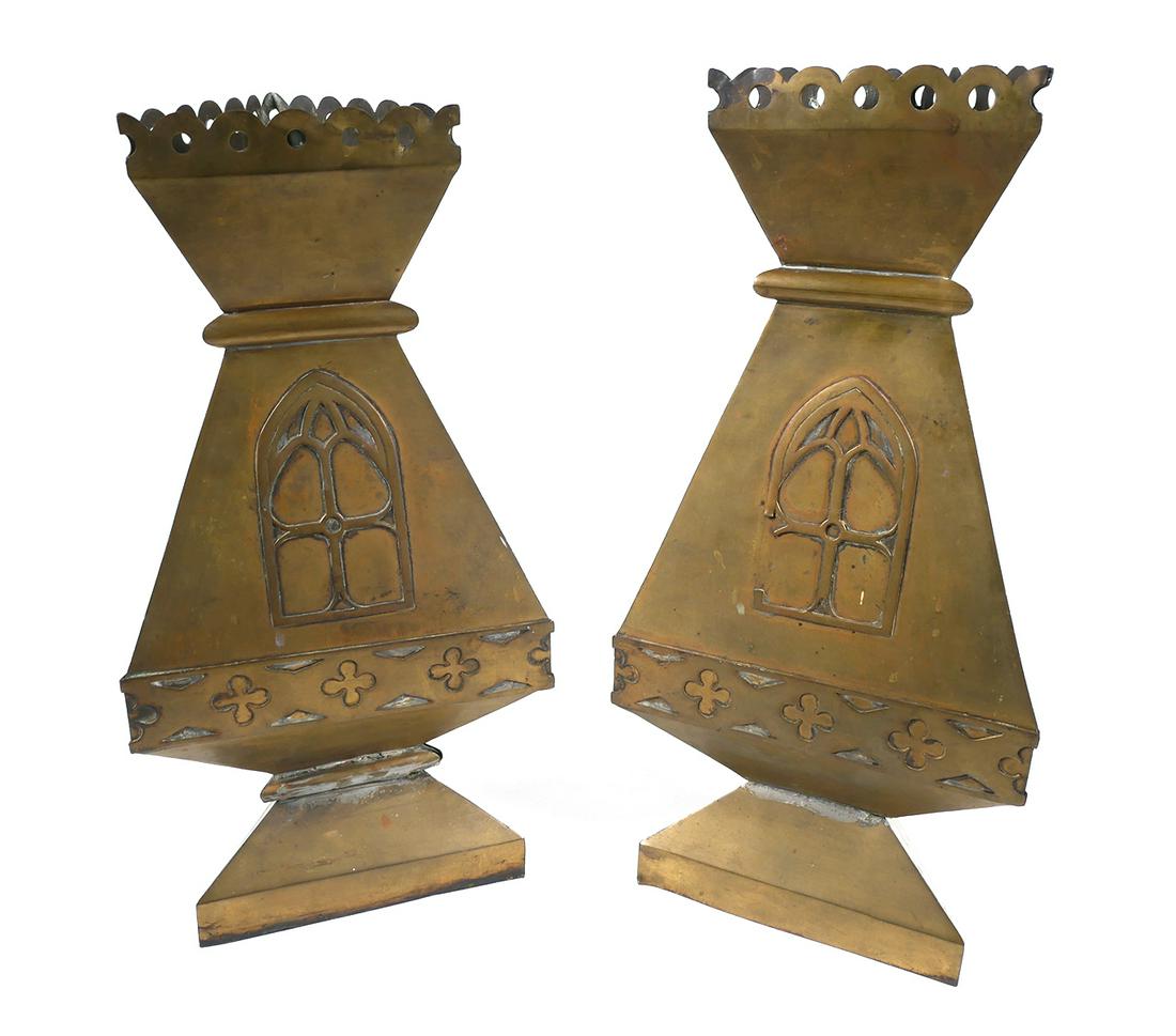 Pair Arts & Crafts Brass Metalwork Sculpture: Two triangular shaped antique brass altar vase sculptures with European cathedral window arch design. Larger metal sculpture measures 17" tall x 8 3/16" wide. Taller vase has some loss to the arch des