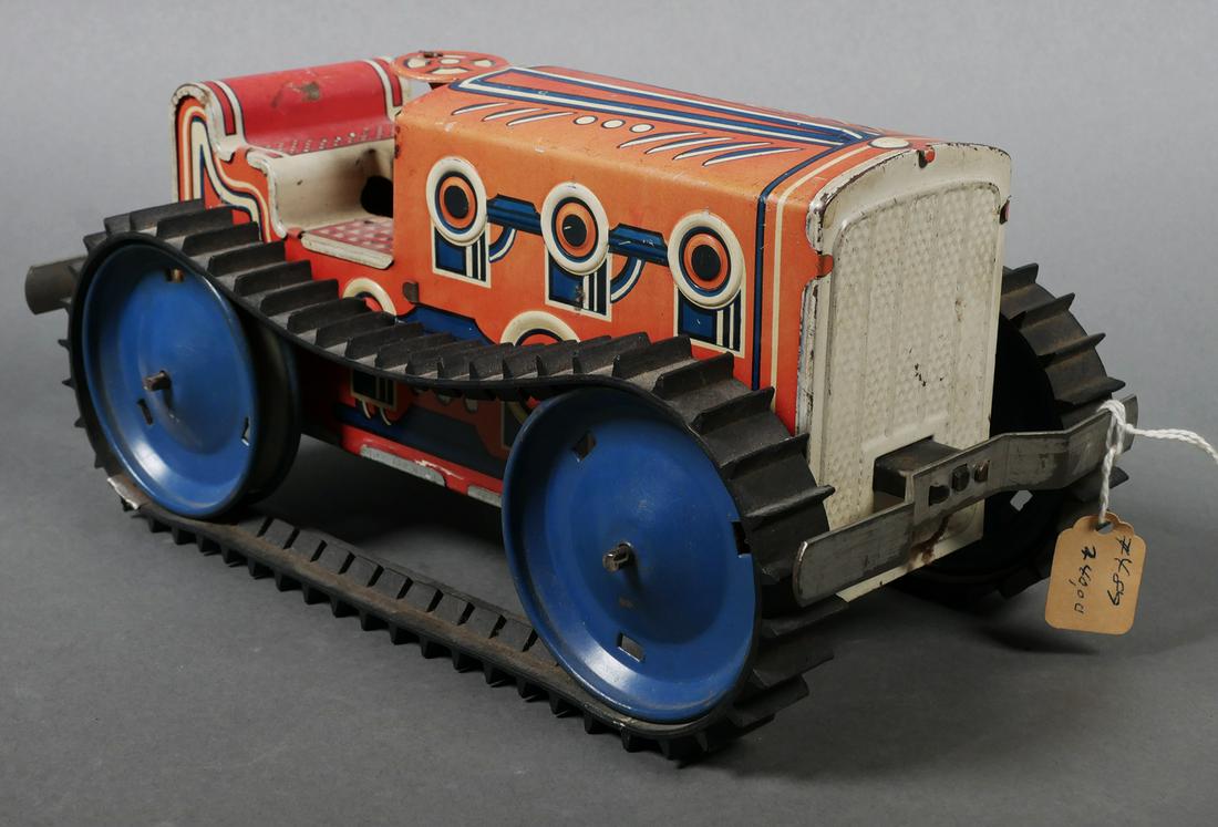 LOUIS MARX Tin Litho Wind Up Toy Tractor: Vintage windup Marx #1 climbing tractor tin lithograph toy. Tractor measures 9 3/4" x 4 3/4" x 4 1/2". Tractor is missing driver and wind up mechanism is not working. Rubber treads are in good conditi
