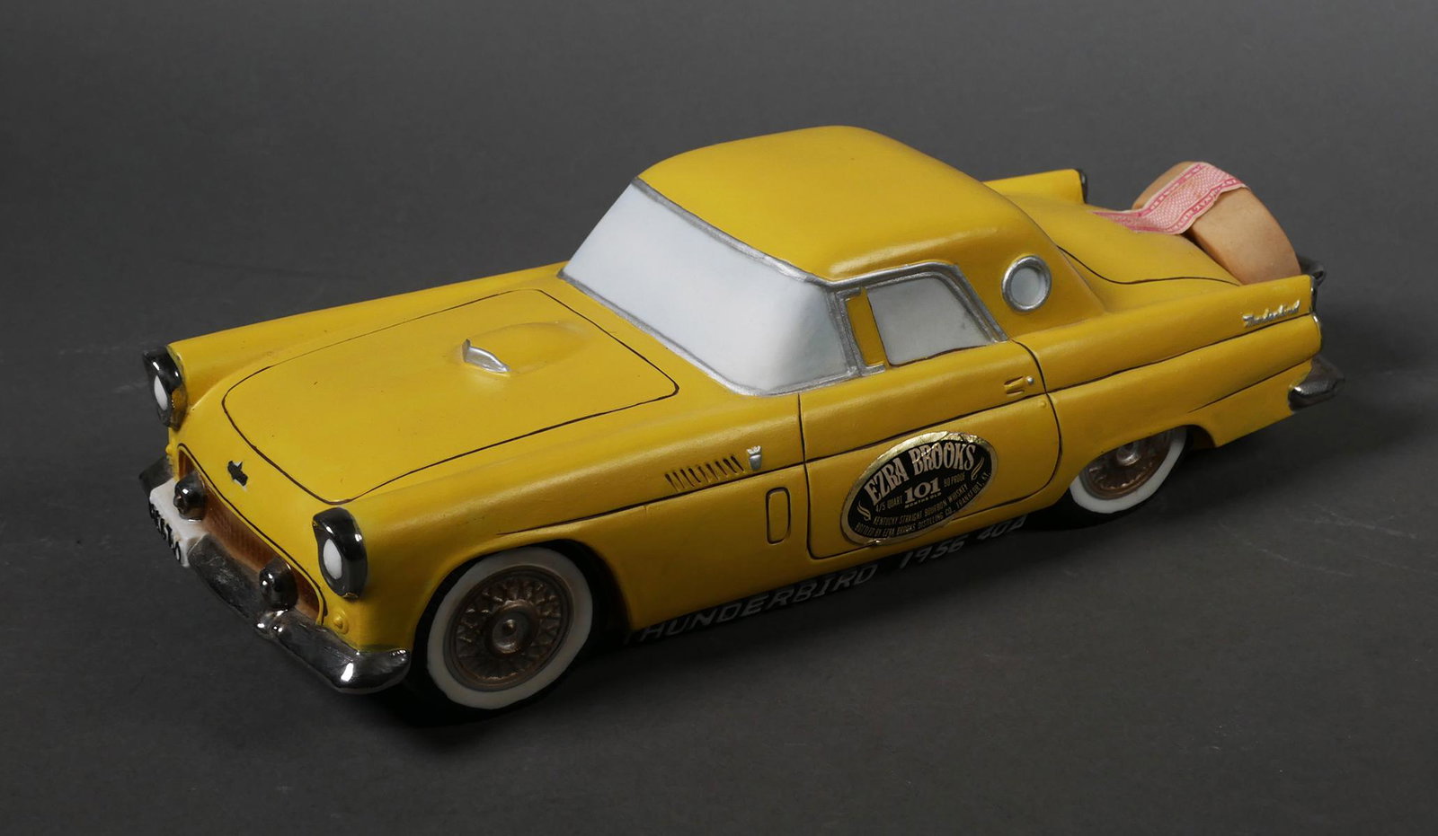 EZRA BROOKS 101 Decanter 1956 Ford Thunderbird: Ezra Brooks 101 4/5 quart 90 proof Kentucky straight bourbon whiskey. Sealed, unopened yellow Ford Thunderbird decanter Decanter is dated on bottom 1976 and part of the classic cars collectors series.