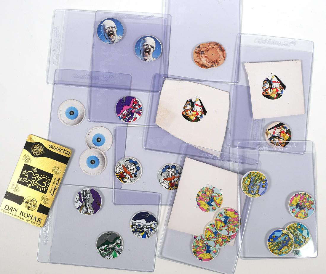 SWATCH WATCH, Design Prototypes DAN KOMAR: Several different cut round watch faces and camera-ready art, presumed to be dials for Swatch watches. Includes a Dan Komar metal business card. Provenance: From the surviving family of the "King of S