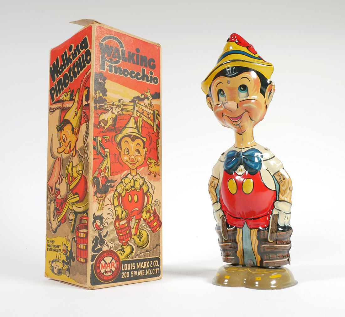 PINOCCHIO 1939 Marx Windup Tin Litho Toy: This tin Pinocchio does walk when wound sufficiently. The back side has the Marx logo and a "copyright 1939 Disney". He stands 9" tall and is in remarkably fine condition. Colors are bright, only a fe