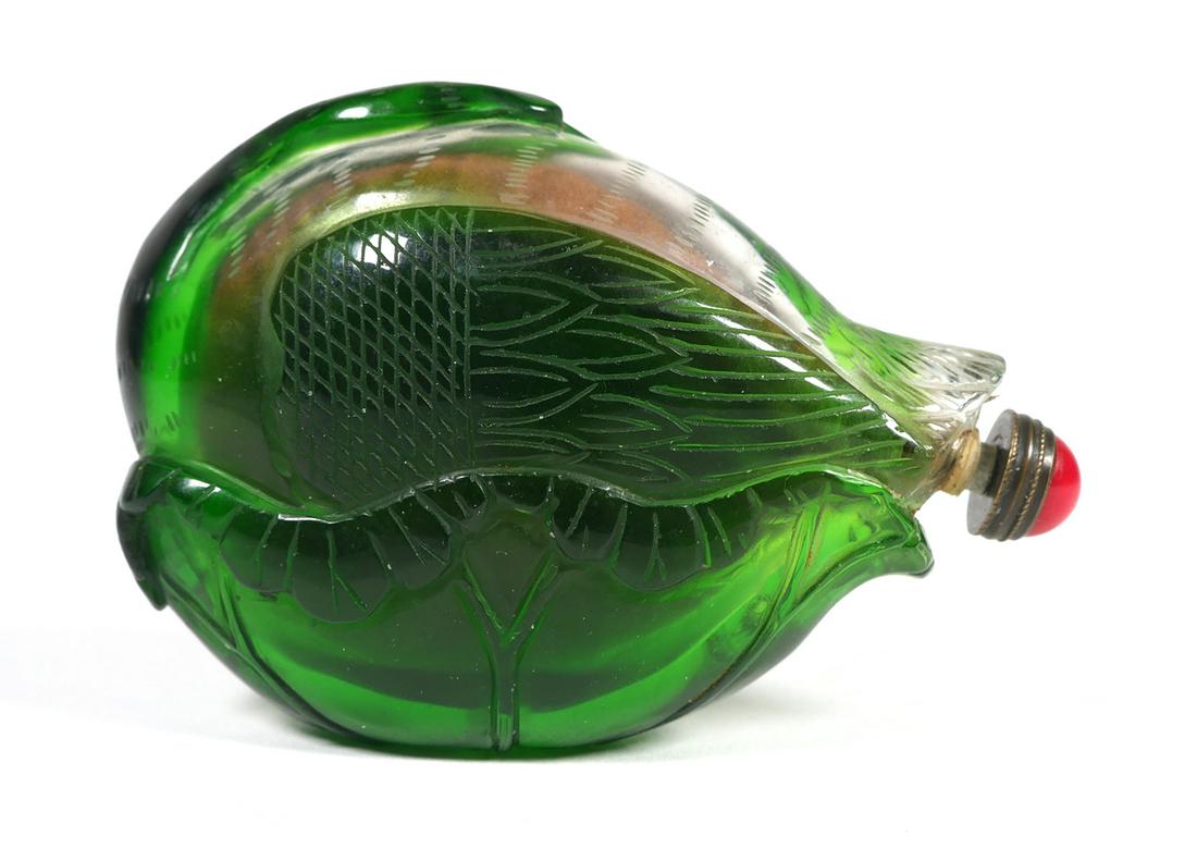 Chinese Cameo Glass Goose SNUFF BOTTLE: This unusual snuff bottle is designed to sit on its side, not bottom. The heavy green Peking cameo glass depicts a stylized goose, not readily apparent until the bottle is on its side. Red glass stopp