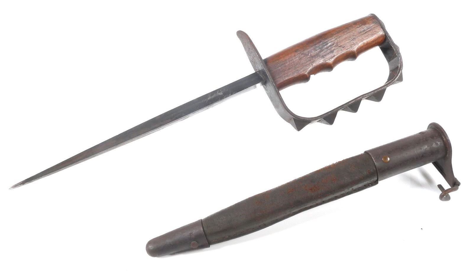 US WWI LF&C Model 1917 Trench Knife and Scabbard: US World War I LF&C M1917 trench knife and scabbard. Hilt and guard with 7 pyramid-shaped projections on the outside of the knuckle guard, including the pommel cap. Face of guard is marked in three li