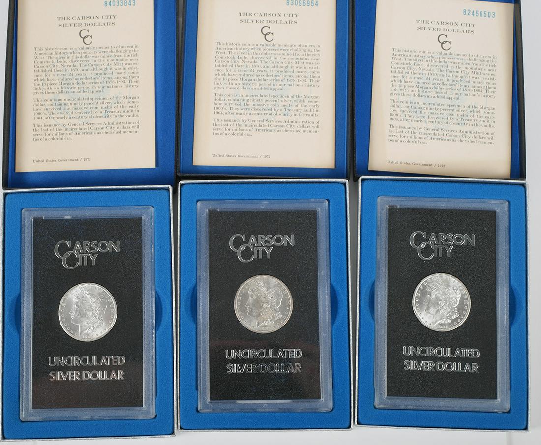 (3) Carson City BU Silver Dollars 1882 1883 1884: Three GSA brilliant uncirculated Carson City Morgan silver dollars. Dates include: 1882-CC, 1883-CC and 1884-CC. Each dollar is in the original GSA plastic holder with box and COA from US Government d