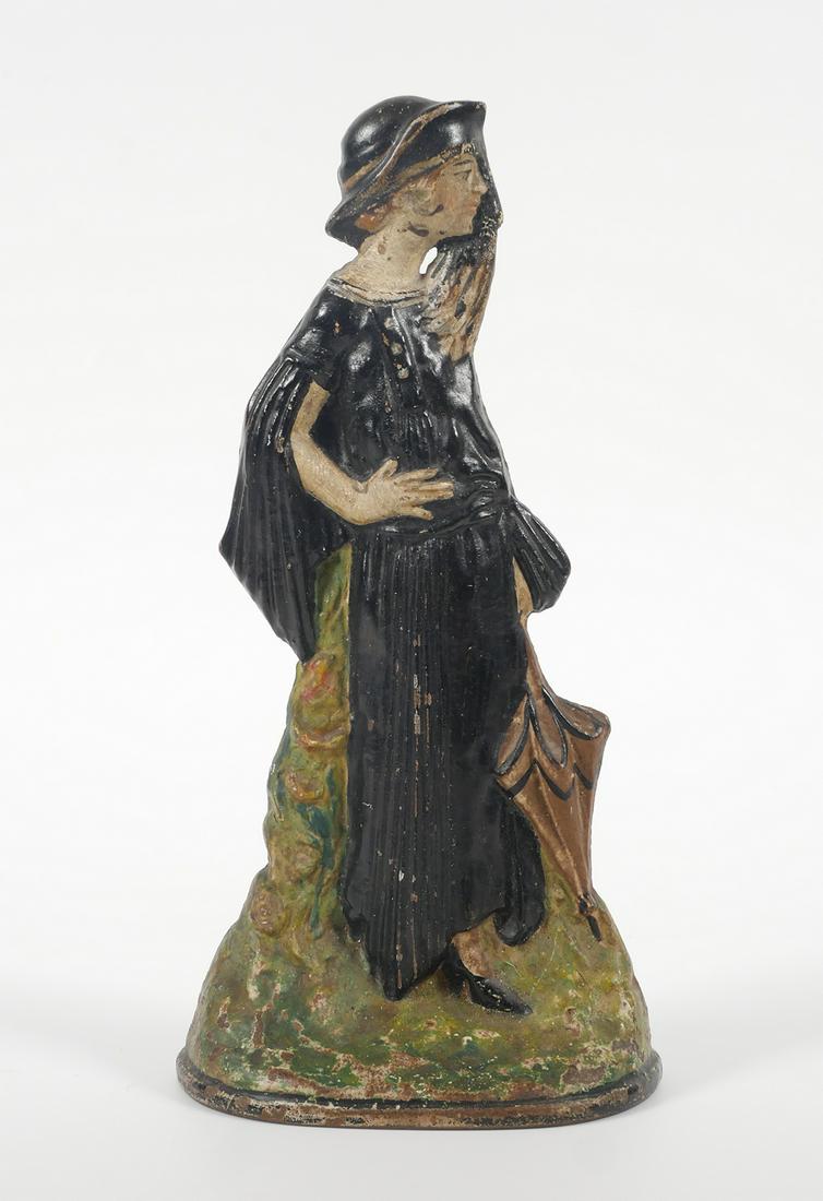 TOLEDO Stove & Range Flapper Girl Doorstop: Antique cast iron flapper lady doorstop by Toledo Stove & Range Co. Doorstop is approx. 9 1/2" tall. Paint appears to be original. Doorstop is in good condition with age appropriate wear. Please see p