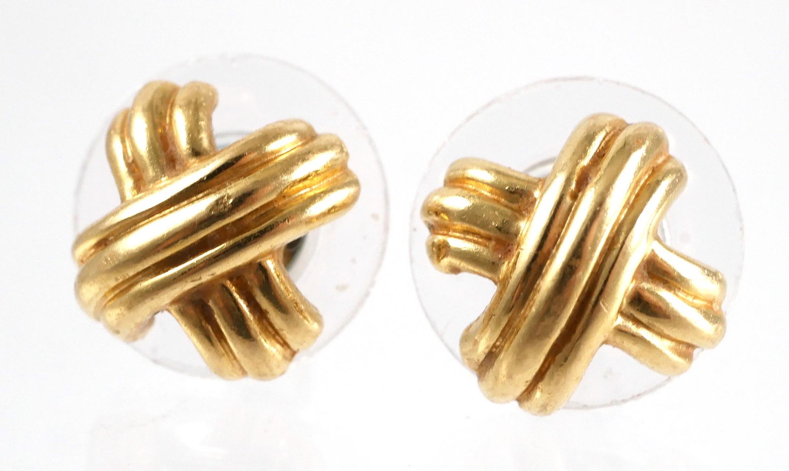 18K Tiffany and Co. Paloma Picasso Earrings: Earrings are set in 18K yellow gold in a crisscross or X pattern. Earrings are marked 750 T&CO on backs. Stud backs. Overall weight is 3 grams. Very good condition, see photos for more details on cond